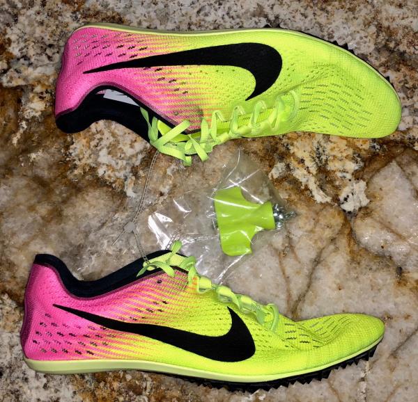 nike track spikes pink and yellow